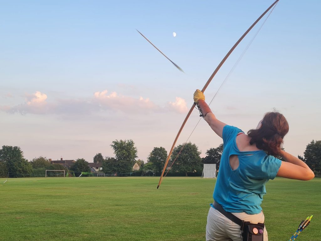 Longbow in action with the moon behind