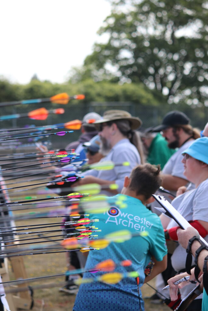 Photo of archers scoring arrows